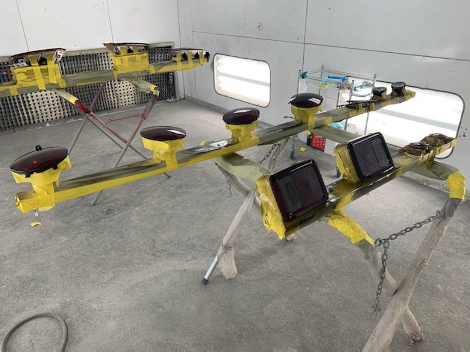 tinted red taillights taped to drying apparatus