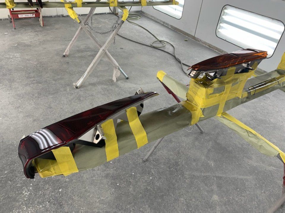 red taillights taped to drying rack