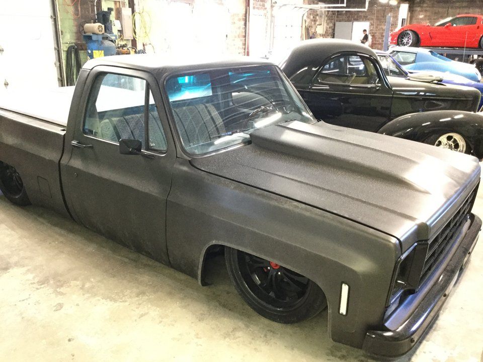 customized grey 1982 chevy c10 pickup truck in side dakota kustomz garage