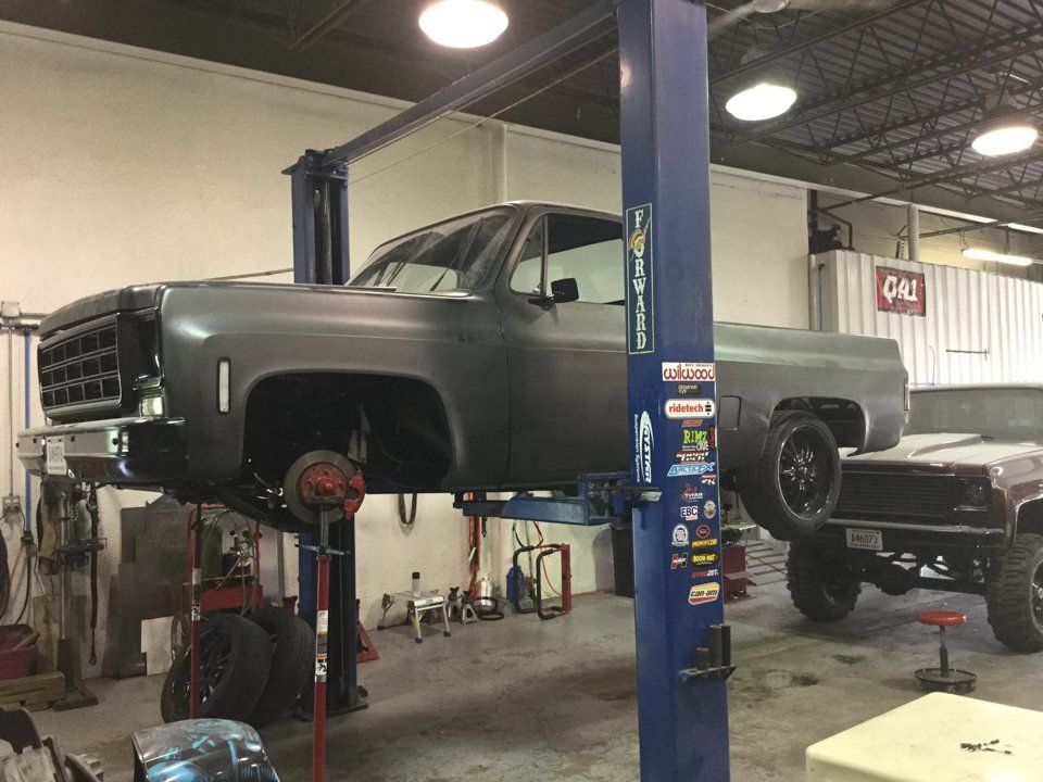 truck with tires removed on car lift