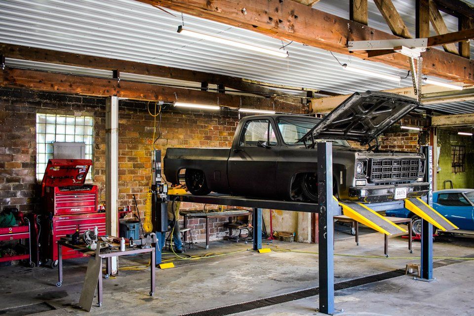 fully customized, lowered lift truck on service bay