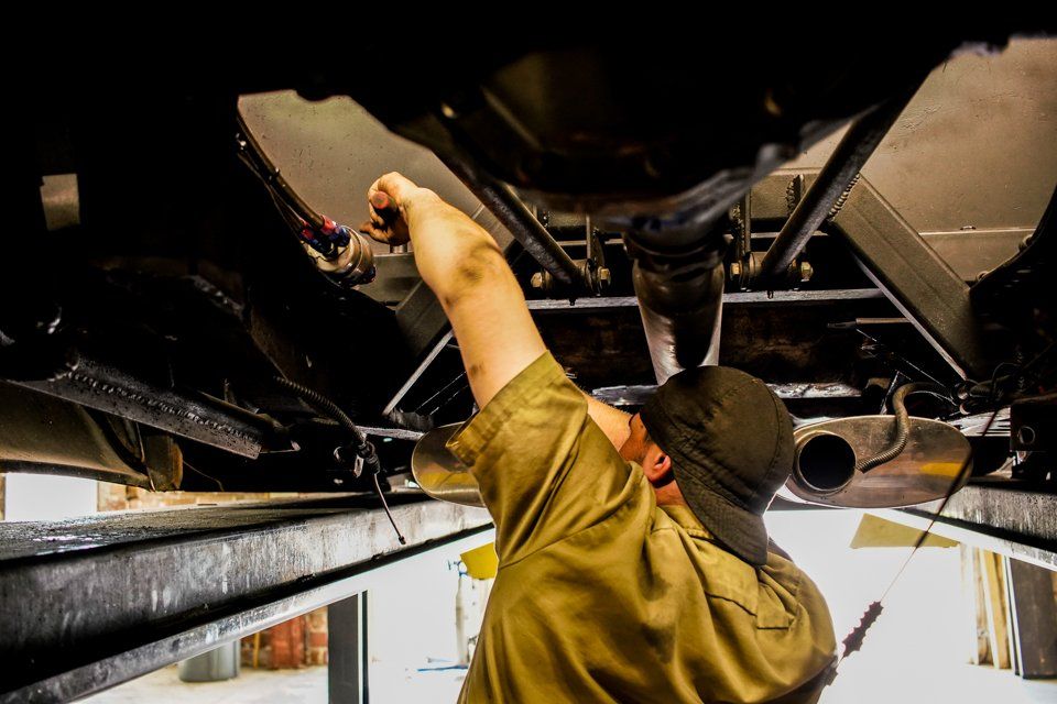 mechanic customizing pickup truck
