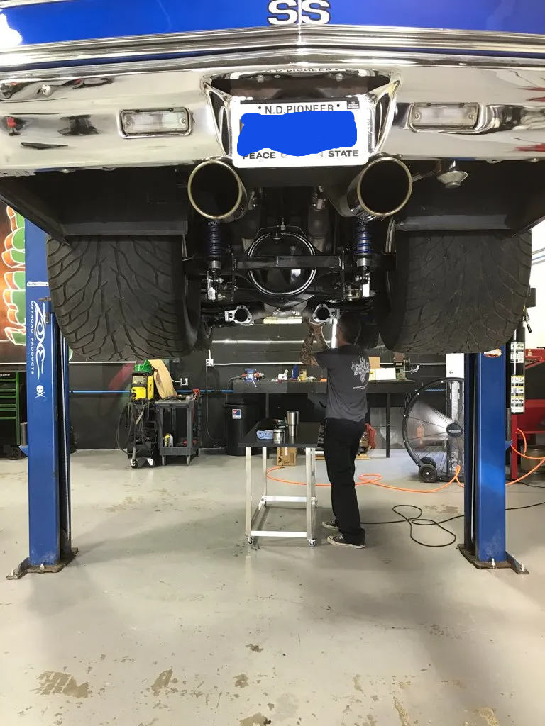 rear view of car on raised service bay