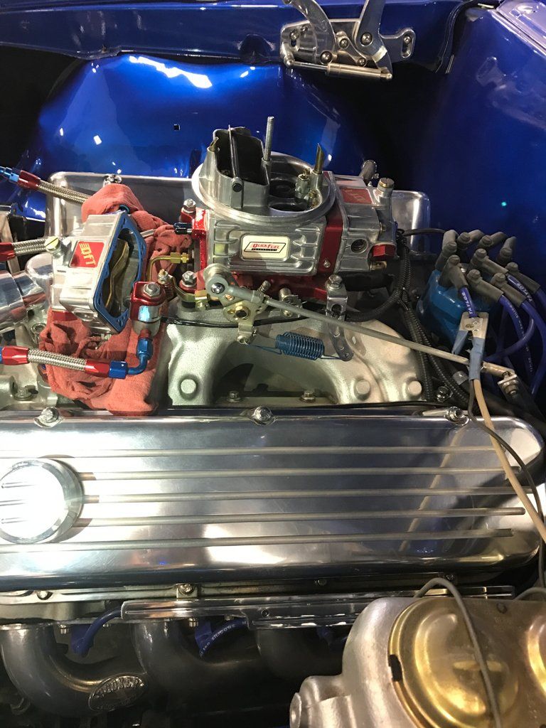 top view of car engine with rag around parts