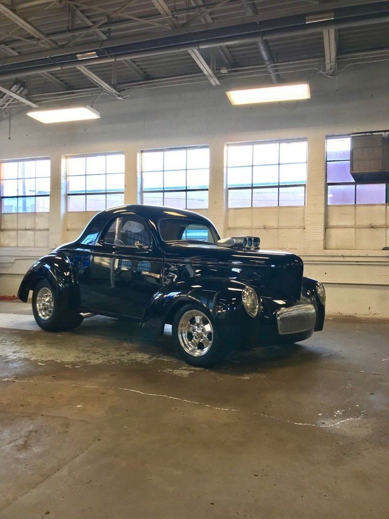 side profile view of custom black 1941 willys coupe