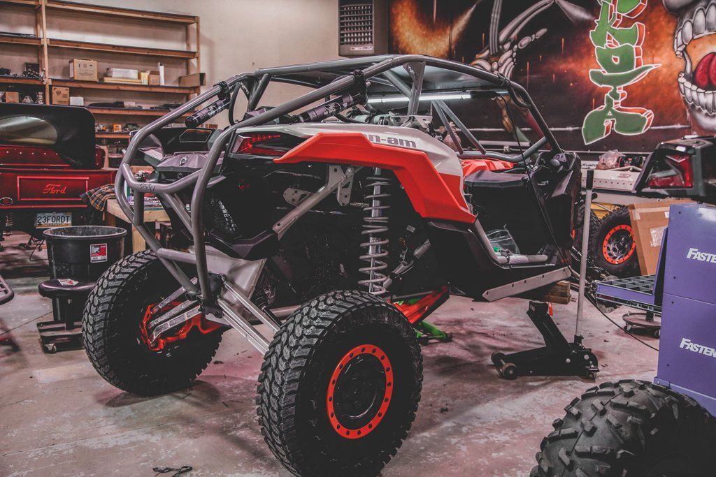 custom 2021 red and black maverick inside service garage