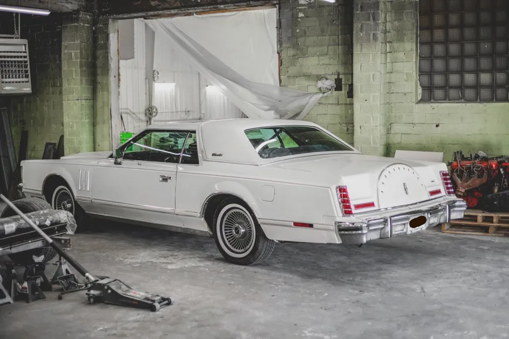 customized white lincoln rear side view