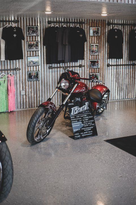 custom red motorcyle inside Dakota Kustomz shop