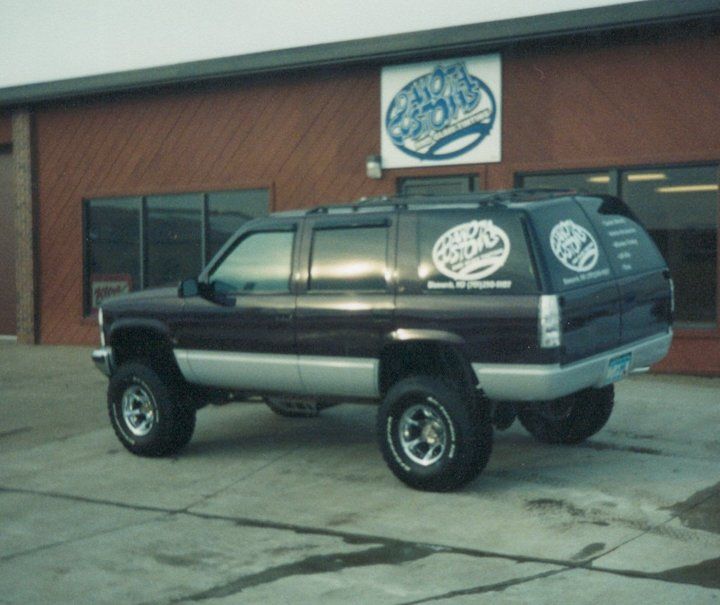 Old Dakota Kustomz black SUV with lift accessory