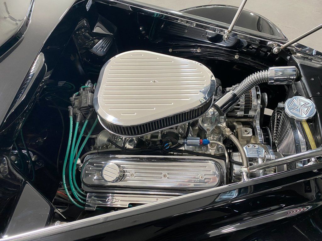 engine of custom black 1937 ford tudor hot rod