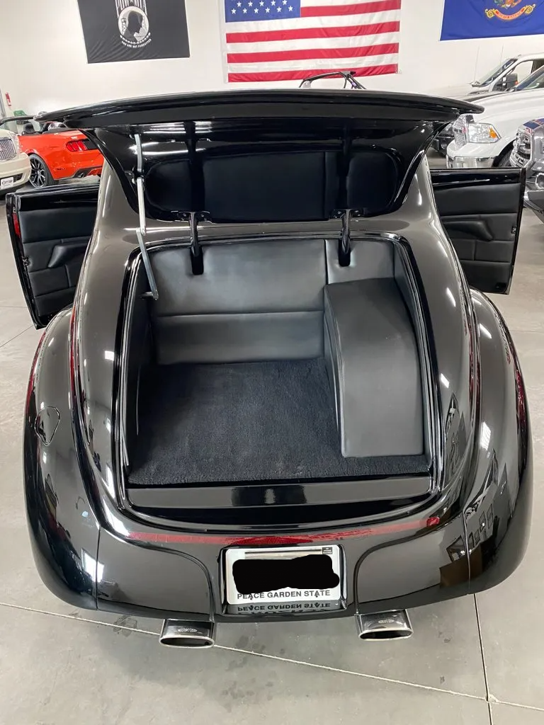 rear view custom black 1937 ford tudor hot rod