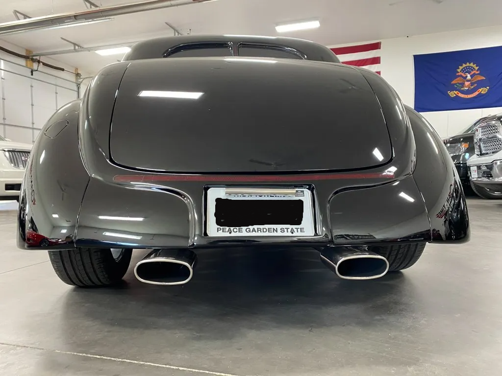 rear view of custom black 1937 ford tudor hot rod