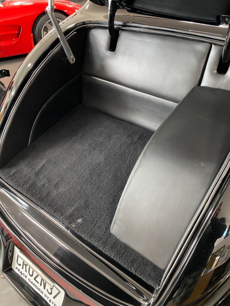 trunk opened for custom black 1937 ford tudor hot rod