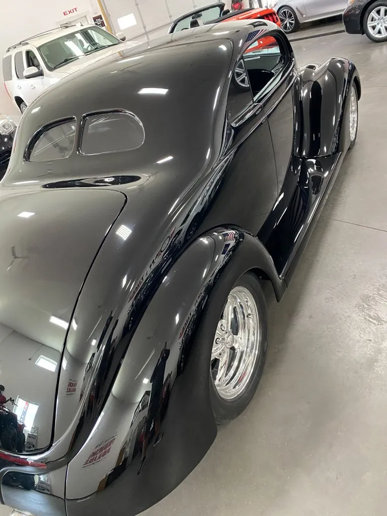 side view custom black 1937 ford tudor hot rod