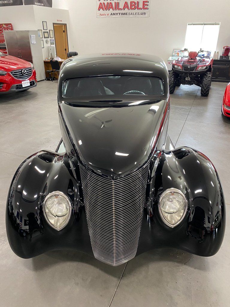 front view of custom black 1937 ford tudor hot rod