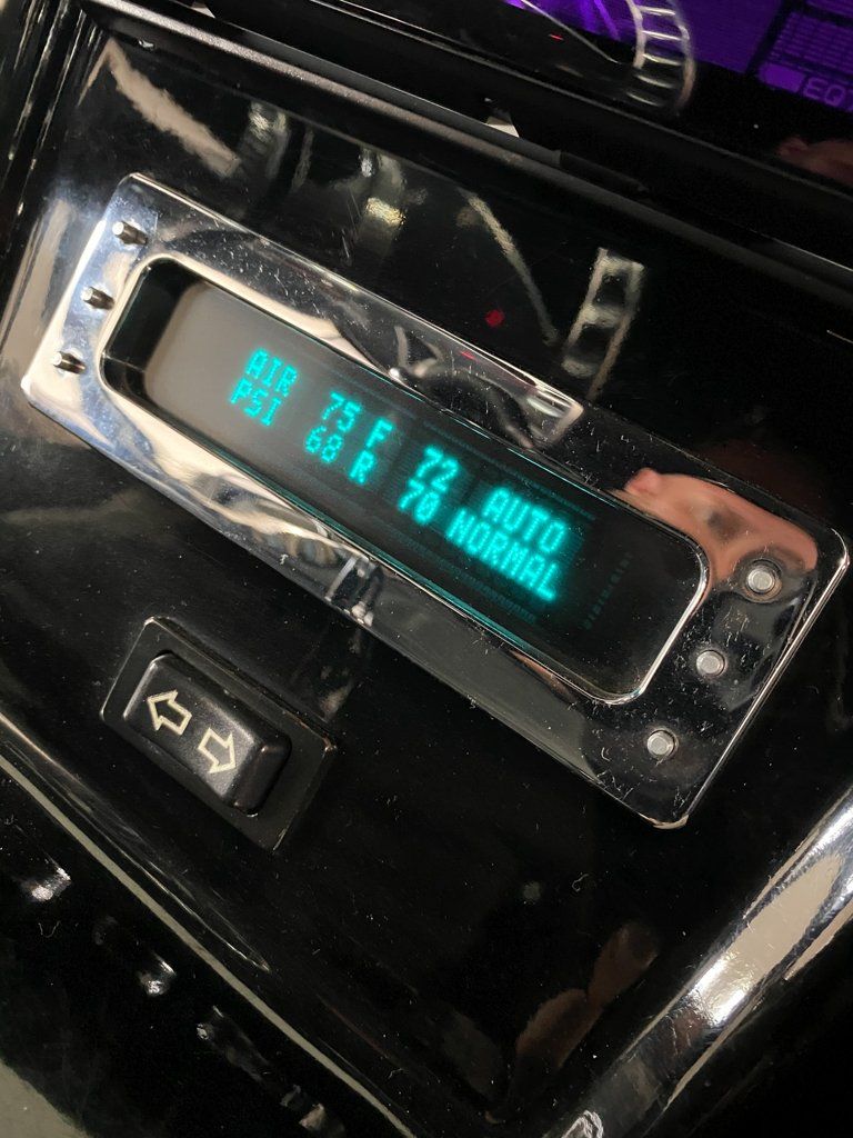 blue and black LED display of tire pressure tool