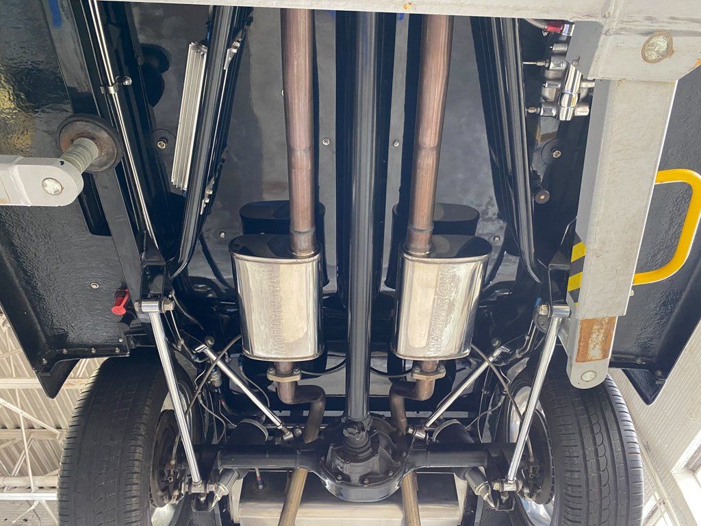 customized 1937 black ford tudor under view