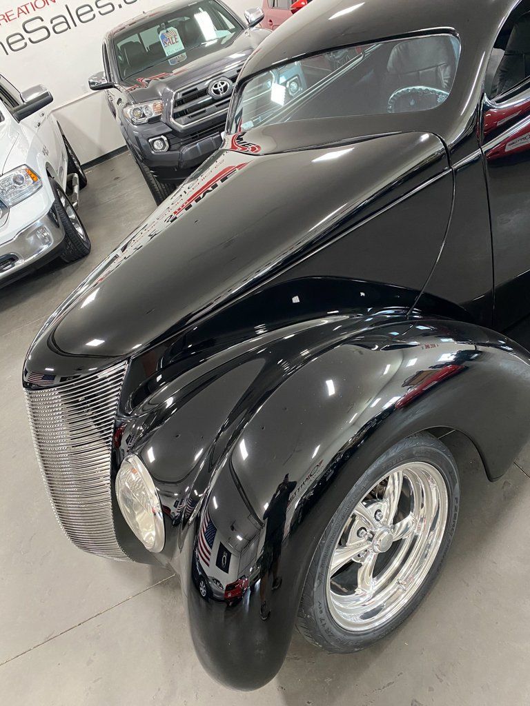 customized 1937 black ford tudor top front view
