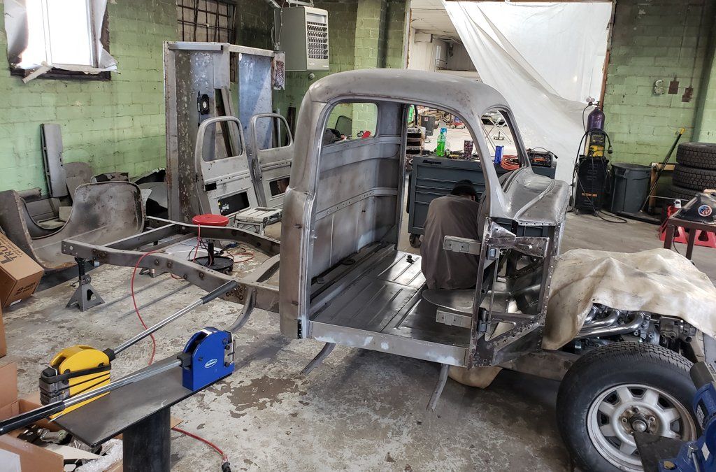 truck frame with bed and doors removed
