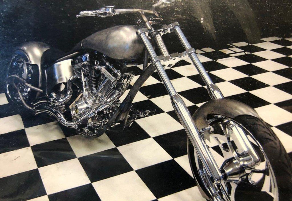 front side view of motorcycle on workbench