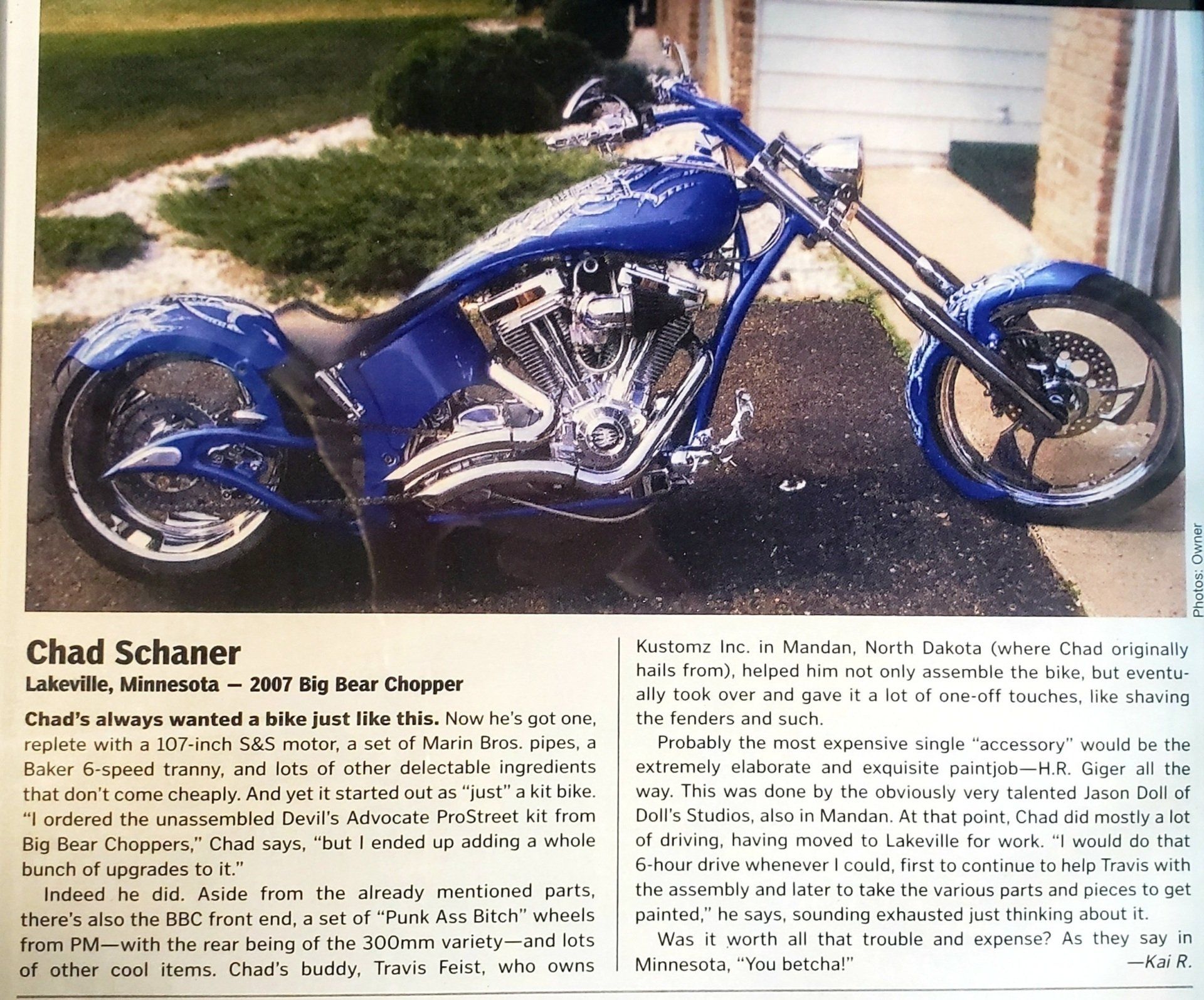 side view of blue motorcycle with more detailing in magazine article