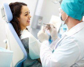 Woman Getting Her Teeth Cleaned - Dental Care