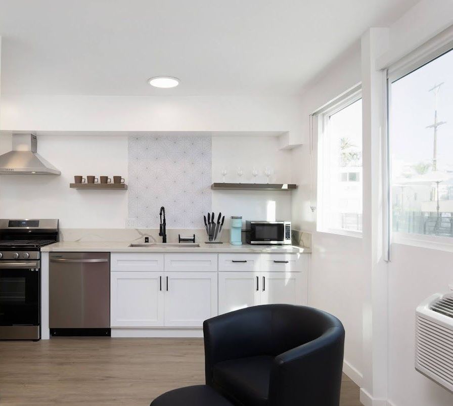 Kitchen photo showing plenty of natural light and a contemporary interior