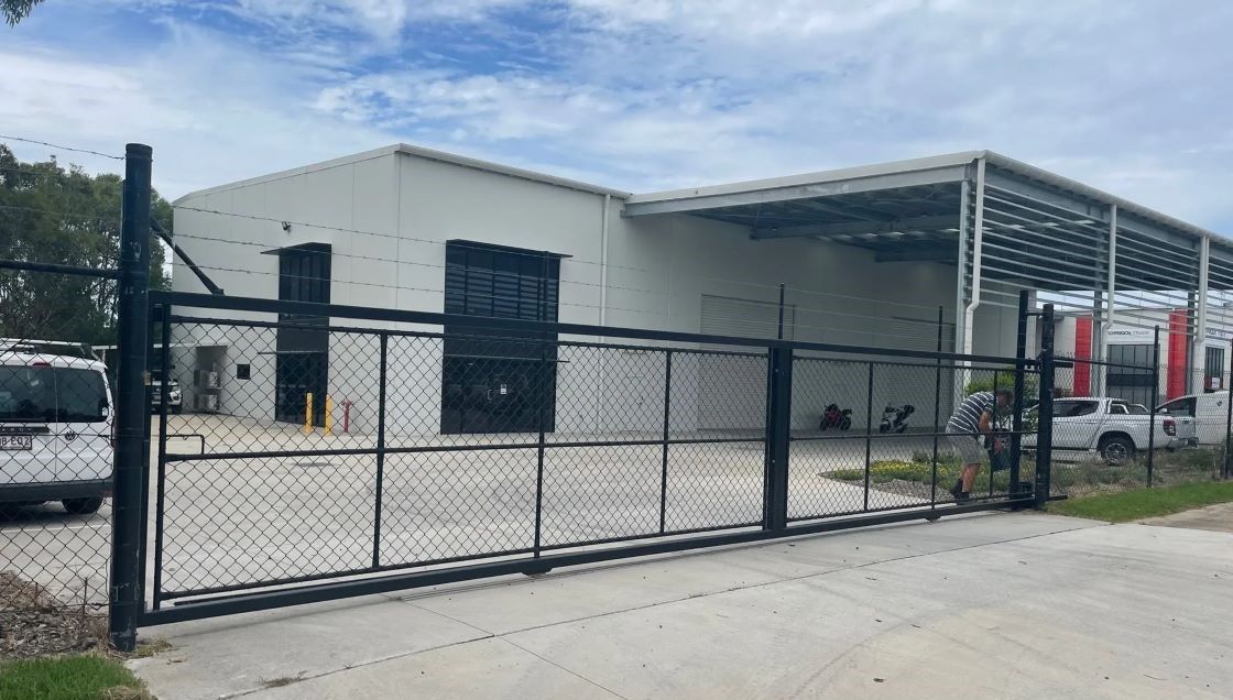 Heavy-duty security gate Brisbane industrial site with chain wire fencing
