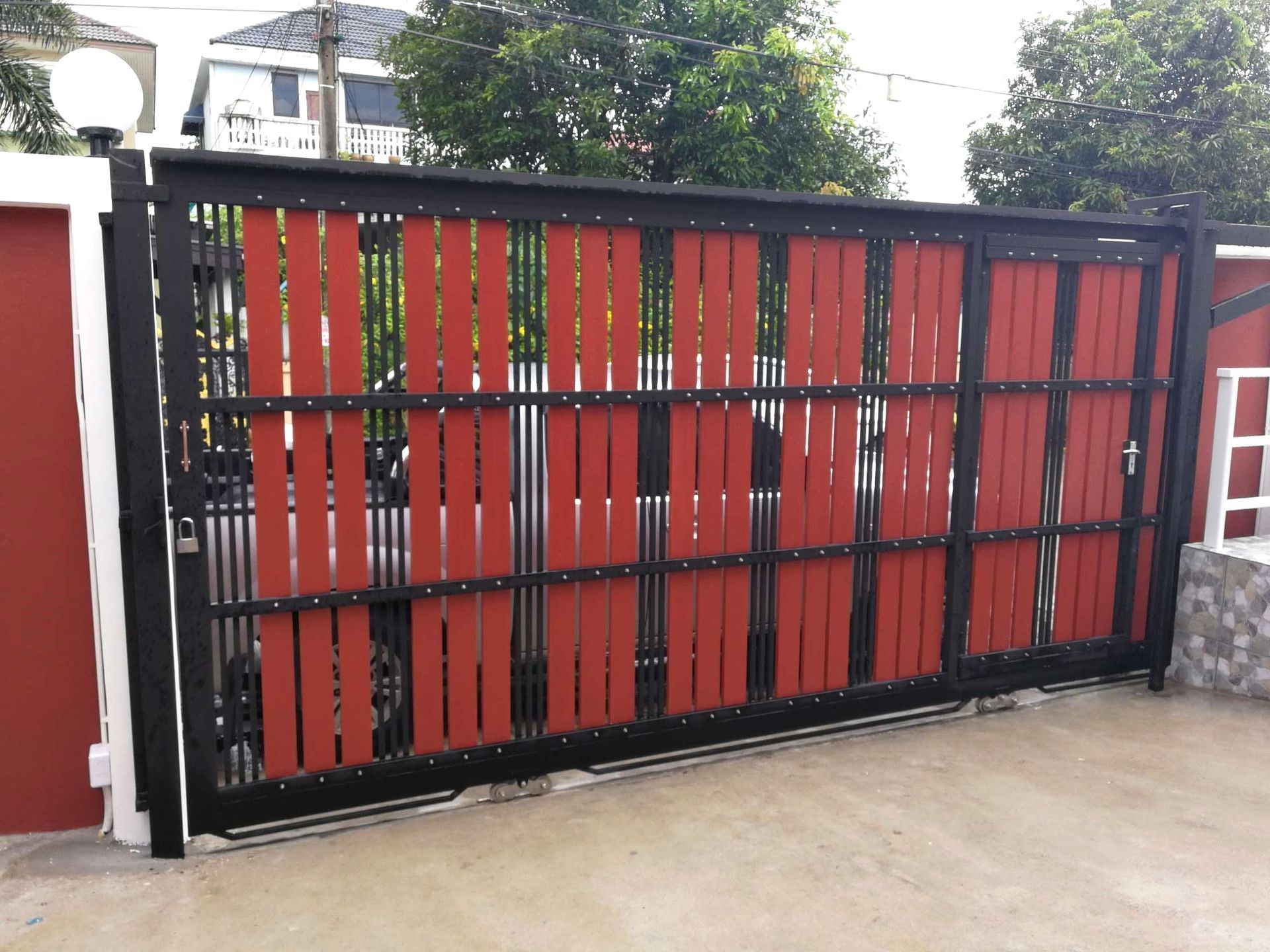 black steel gate frame with timber paling infill for residential fencing in Brisbane