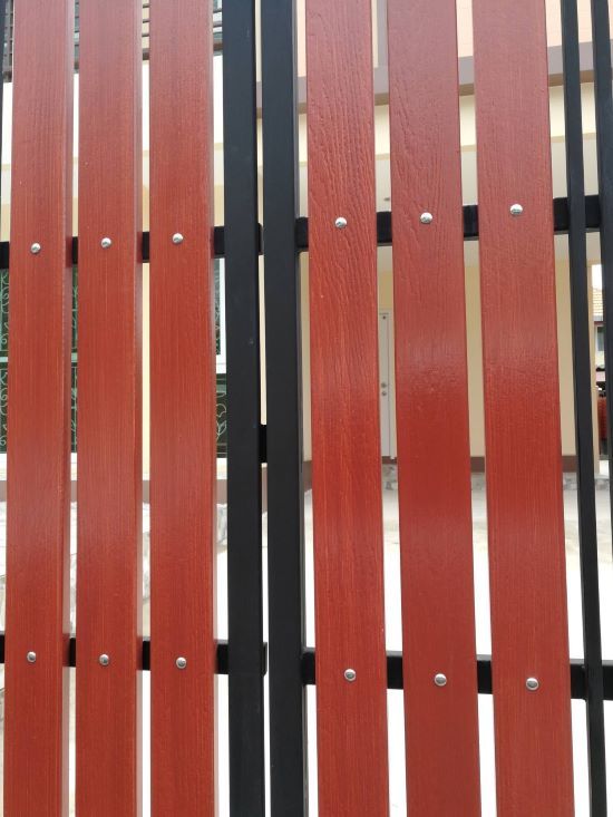 powder-coated steel gate frame with timber-look slats for Brisbane fencing project