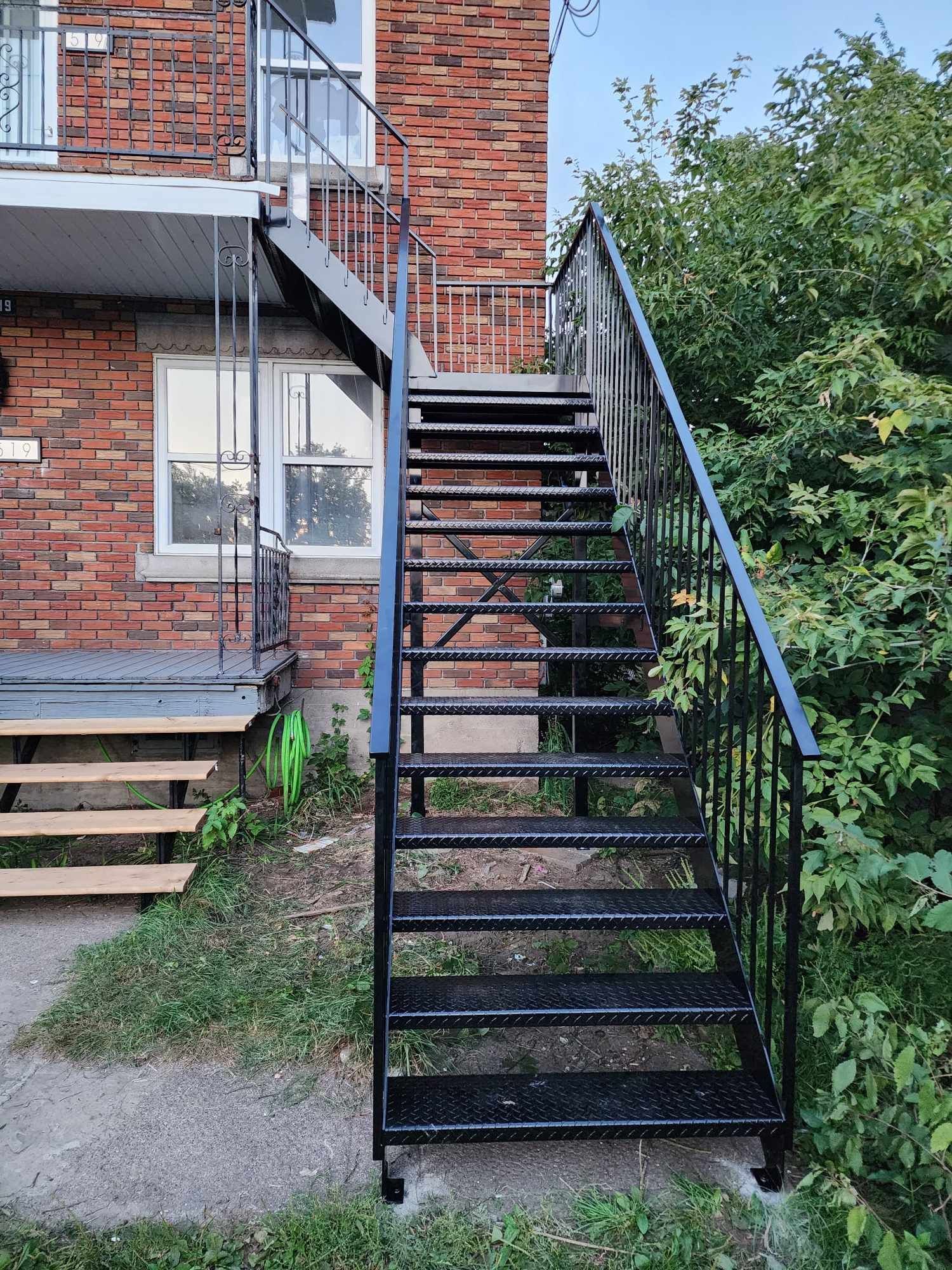 A set of stairs leading up to a brick building.