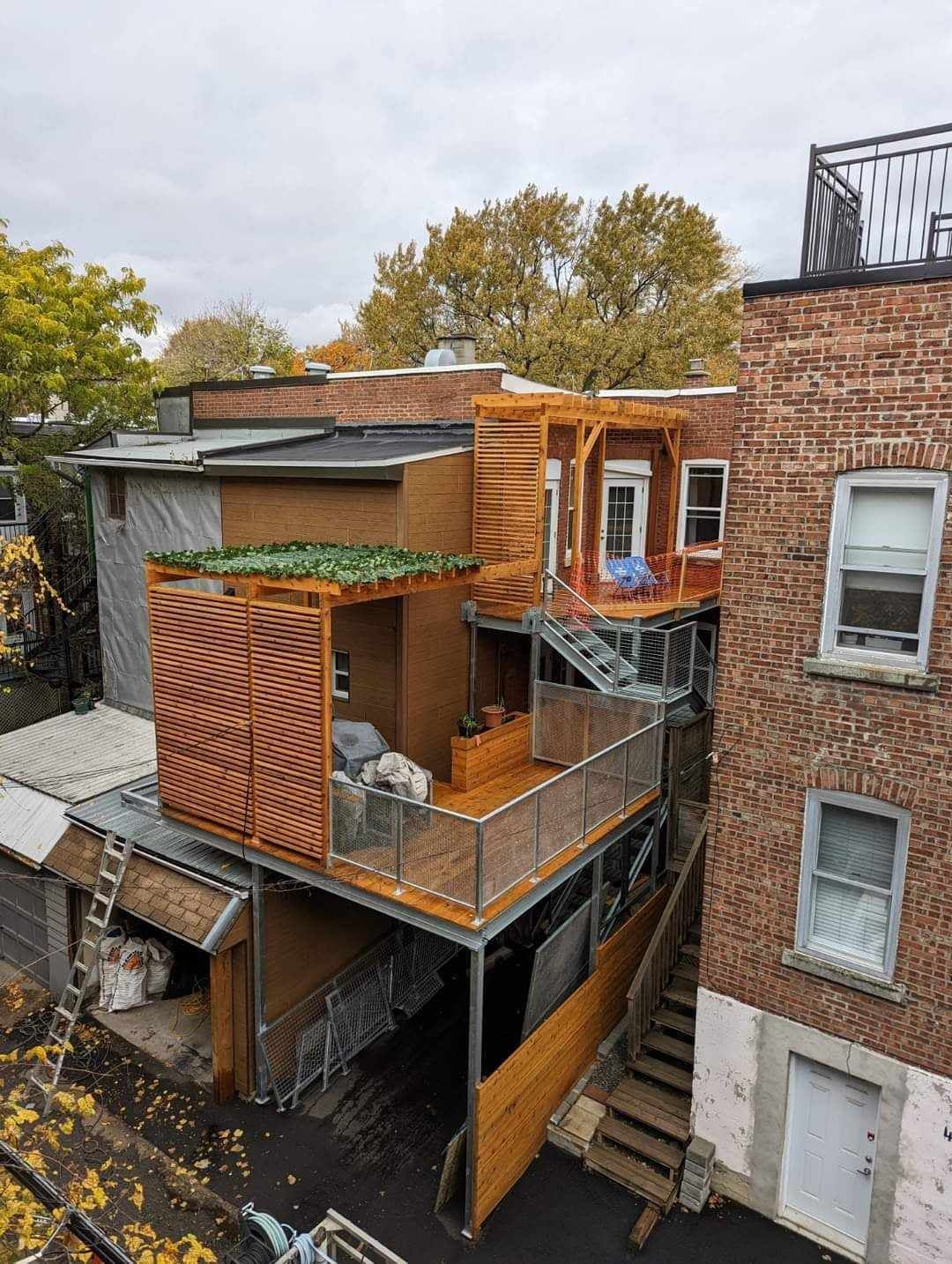An aerial view of a house with a balcony and stairs