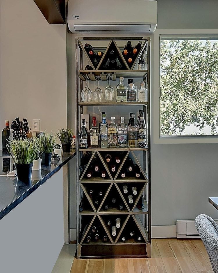 A wine rack filled with bottles of wine in a kitchen.