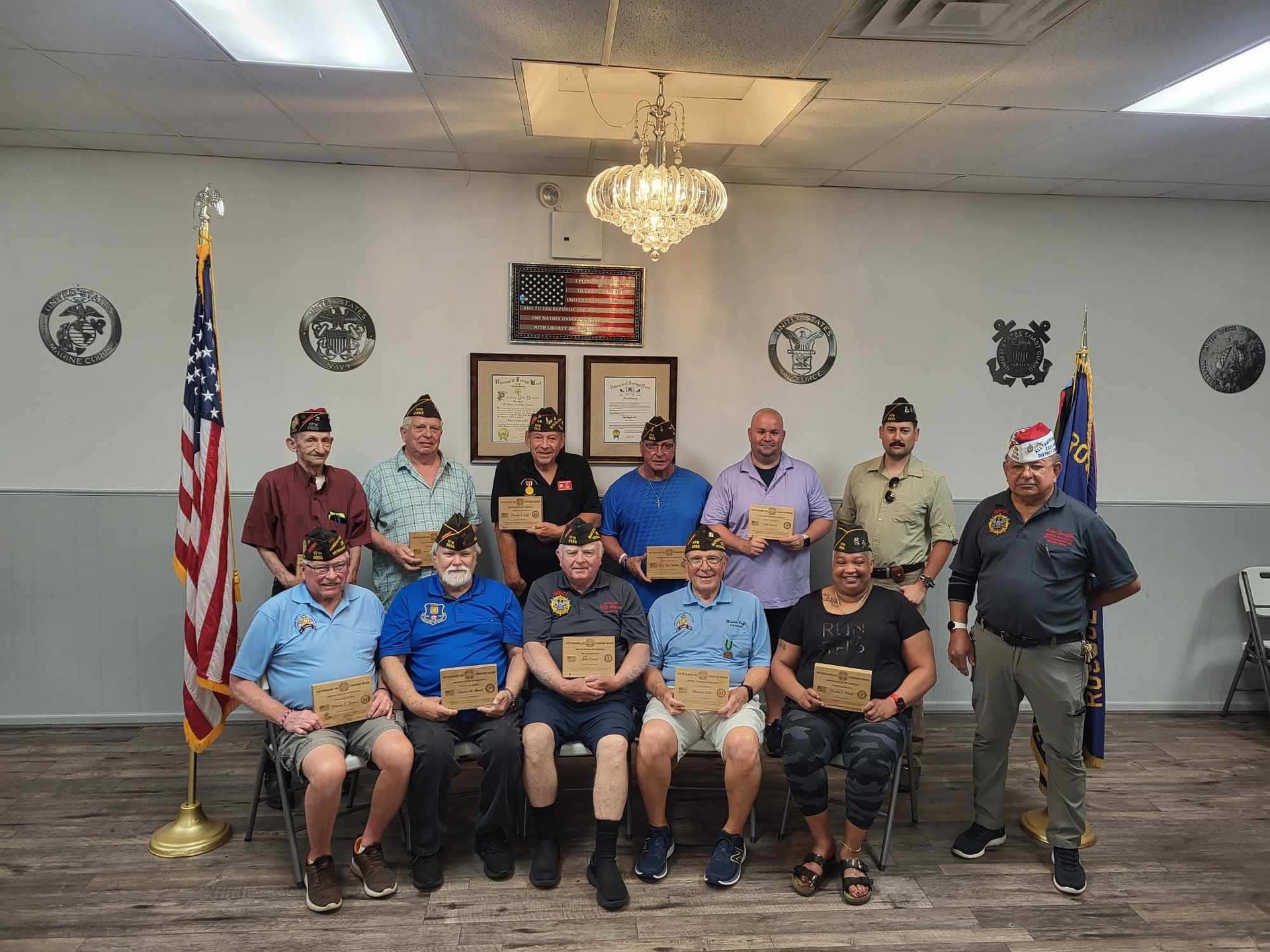 A group of men are posing for a picture in a room.