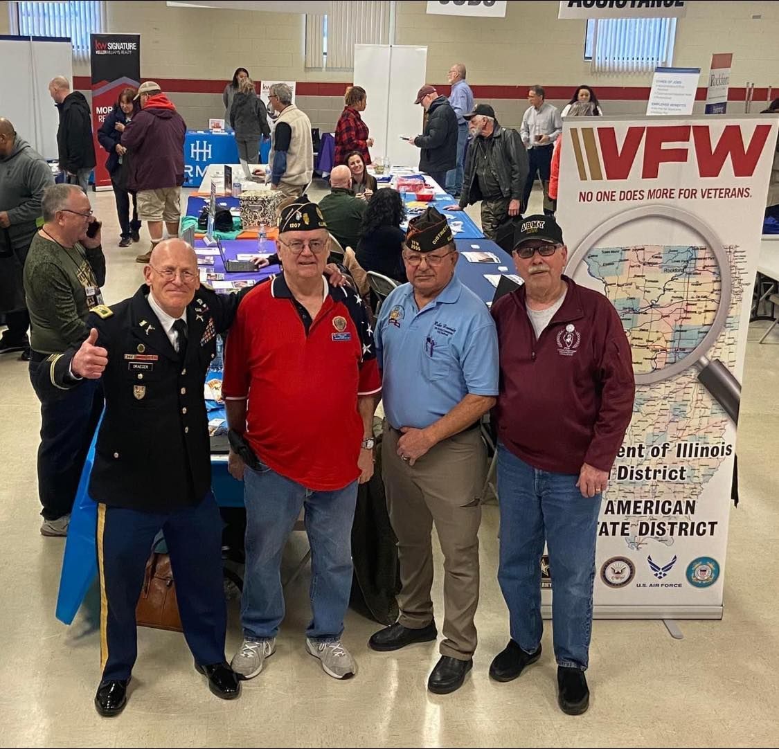 A group of men standing in front of a sign that says VFW
