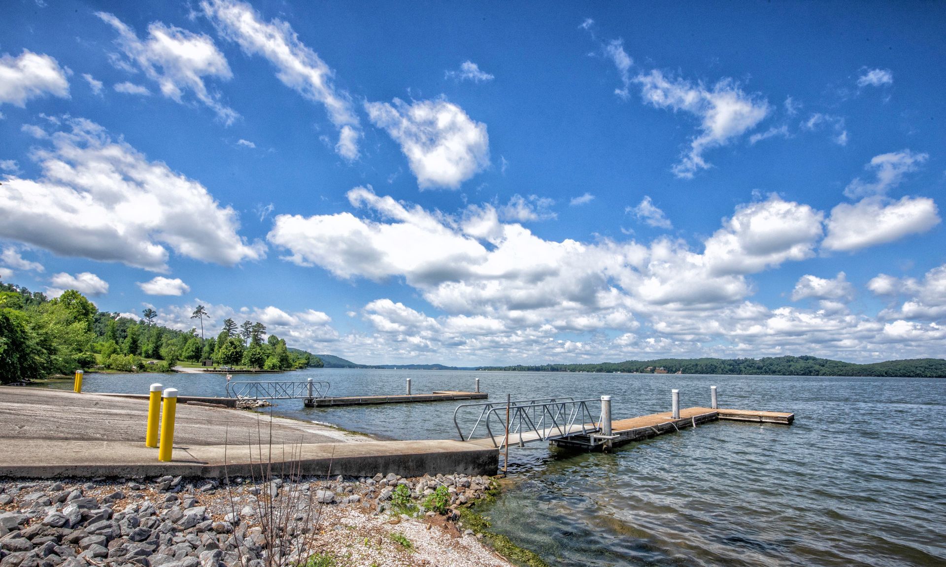 A large body of water with a dock in the middle of it.