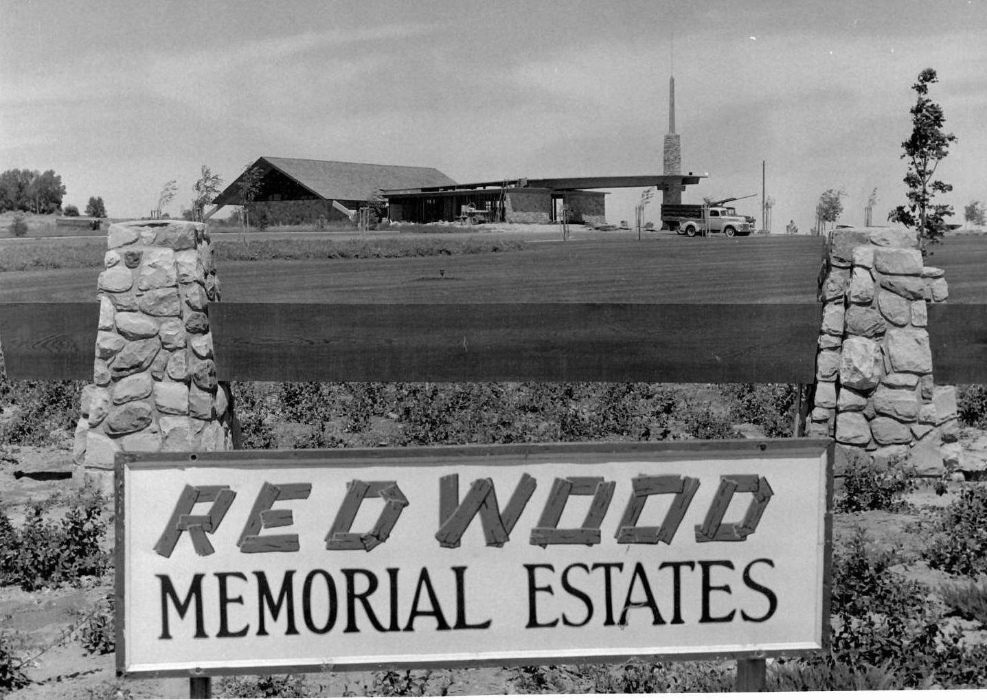 a black and white photo of redwood memorial estates