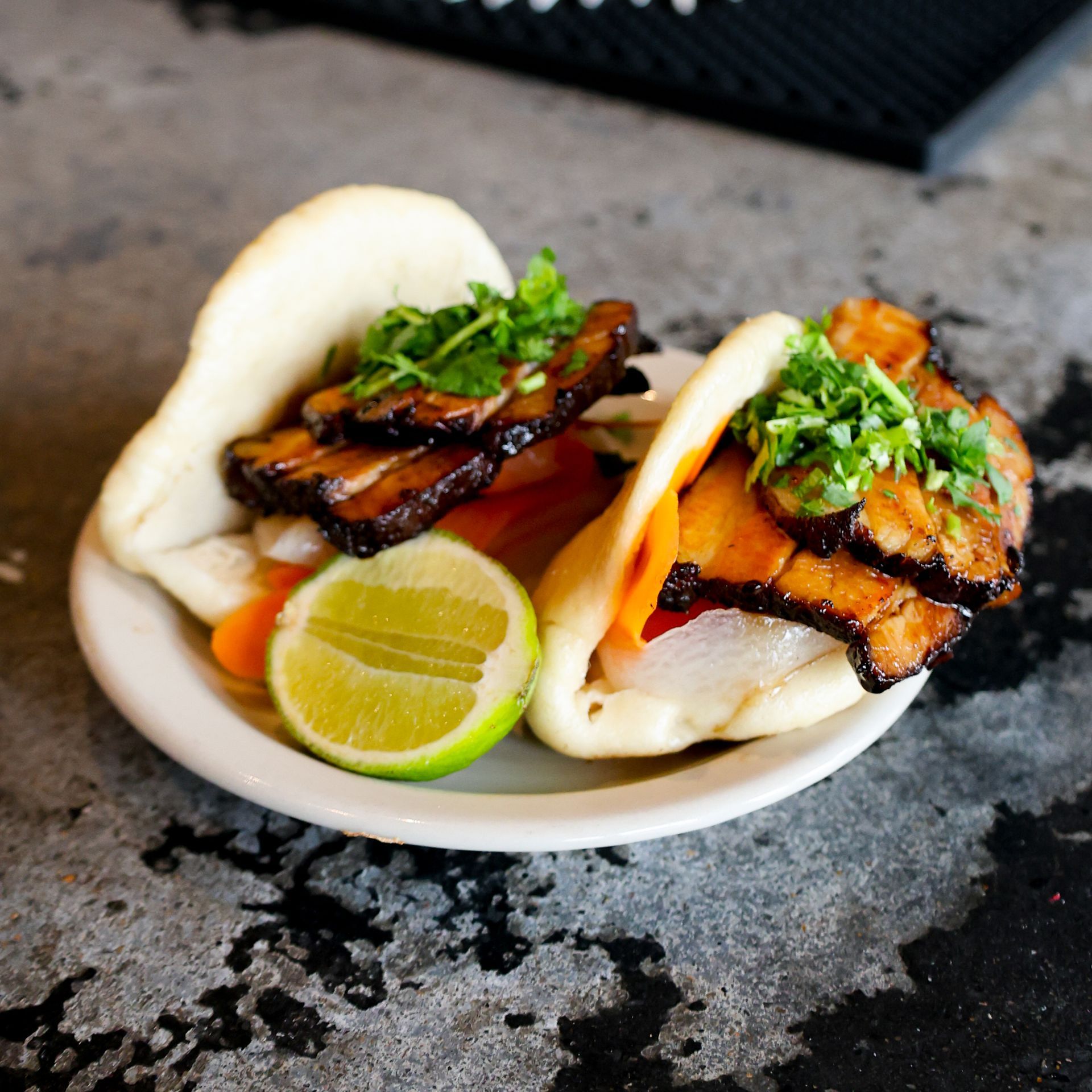Pork belly gua bao loaded with flavor — a street food staple reimagined for South Congress. The perfect handheld bite to fuel your ACL Festival weekend.