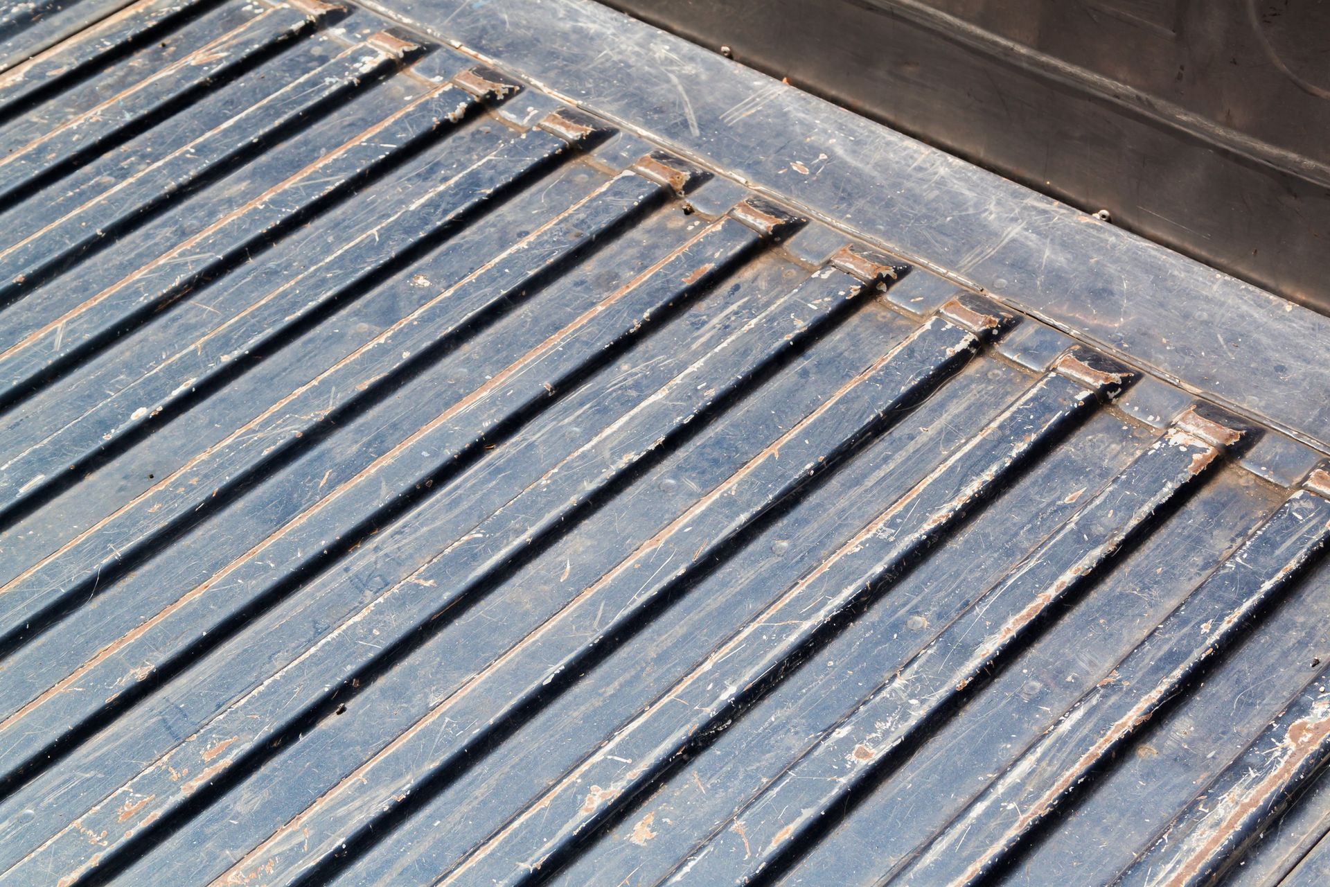 A close up of a wooden floor with lines on it.