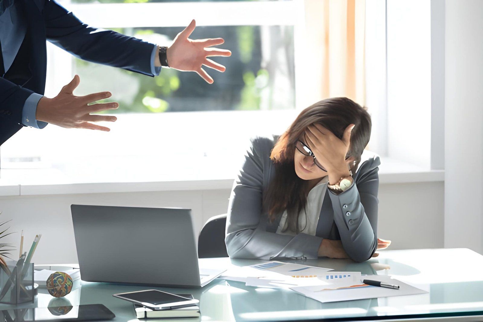 Employee Showing a Person Gesturing With Both Hands Toward a Colleague — Australian Employee Lawyers in Broadbeach Waters, QLD