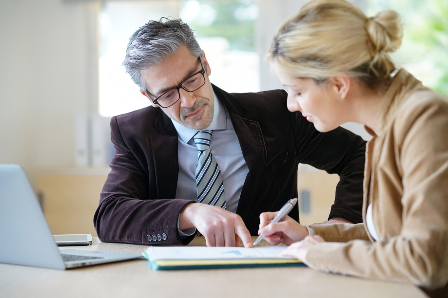 A Person in a Suit Points to a Document — Australian Employee Lawyers in Broadbeach Waters, QLD