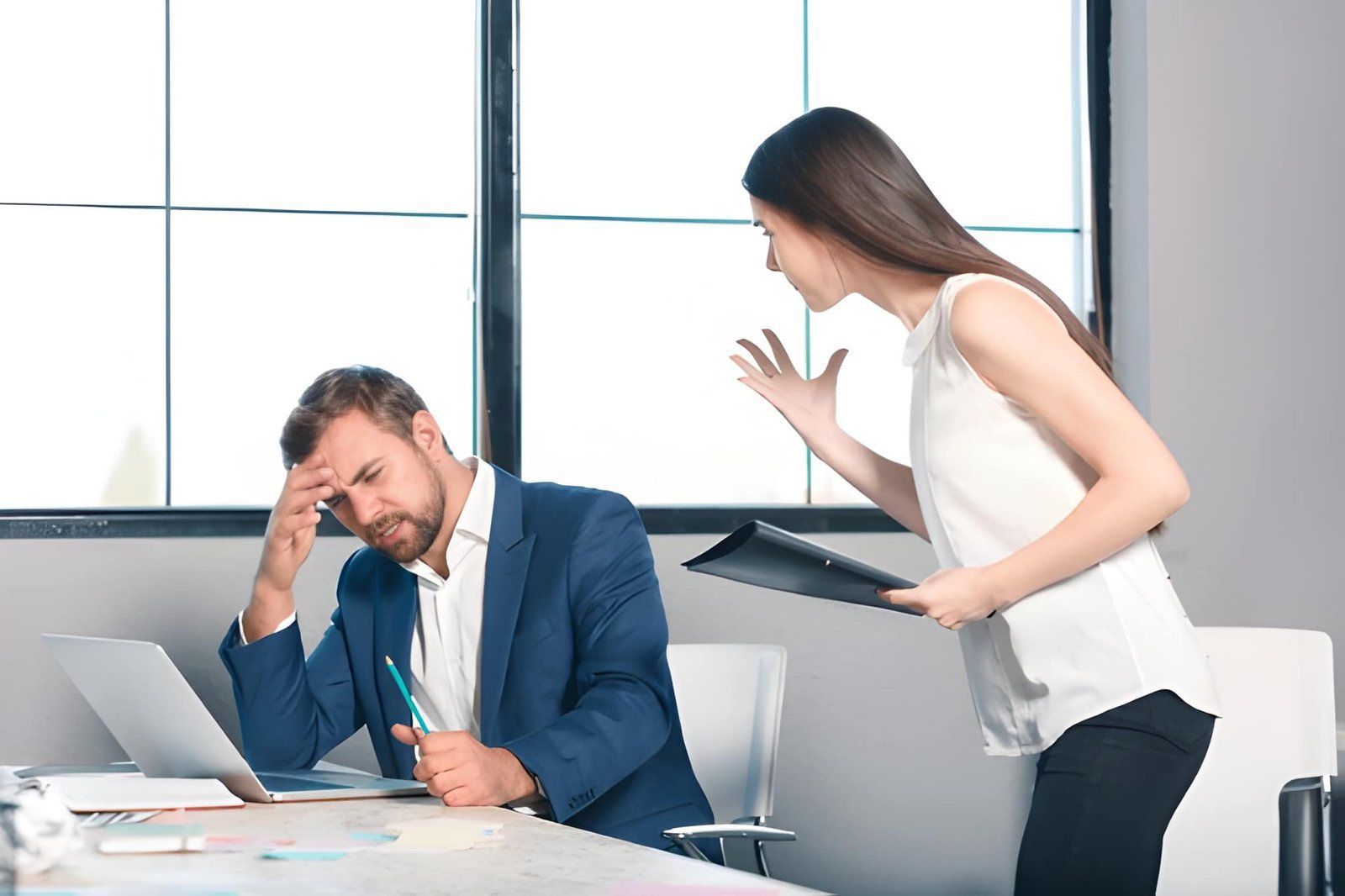 Employee in a Suit Sits at a Desk Looking Stressed — Australian Employee Lawyers in Broadbeach Waters, QLD