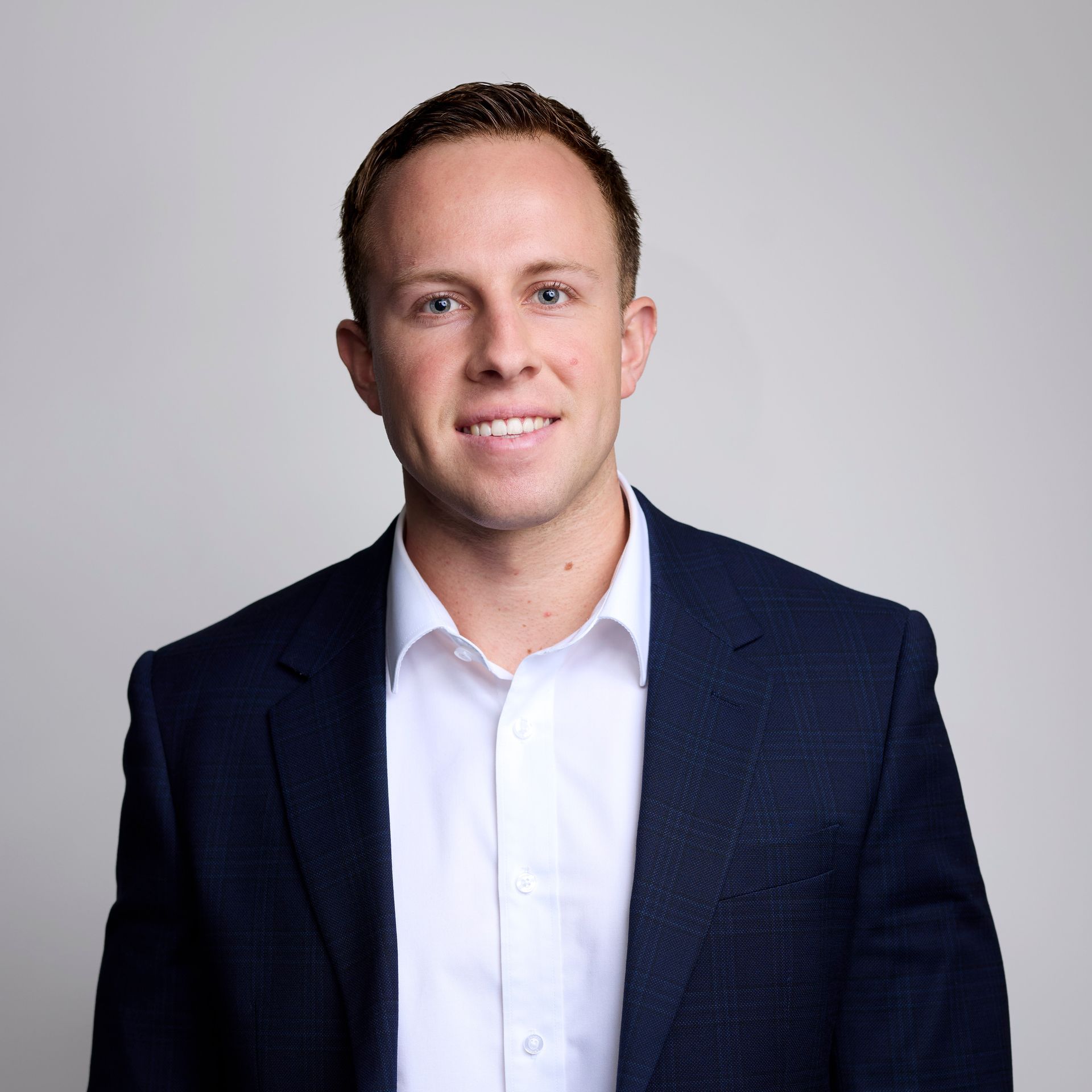 A Person Wearing a White Dress Shirt and a Navy Blue Blazer — Australian Employee Lawyers in Broadbeach Waters, QLD