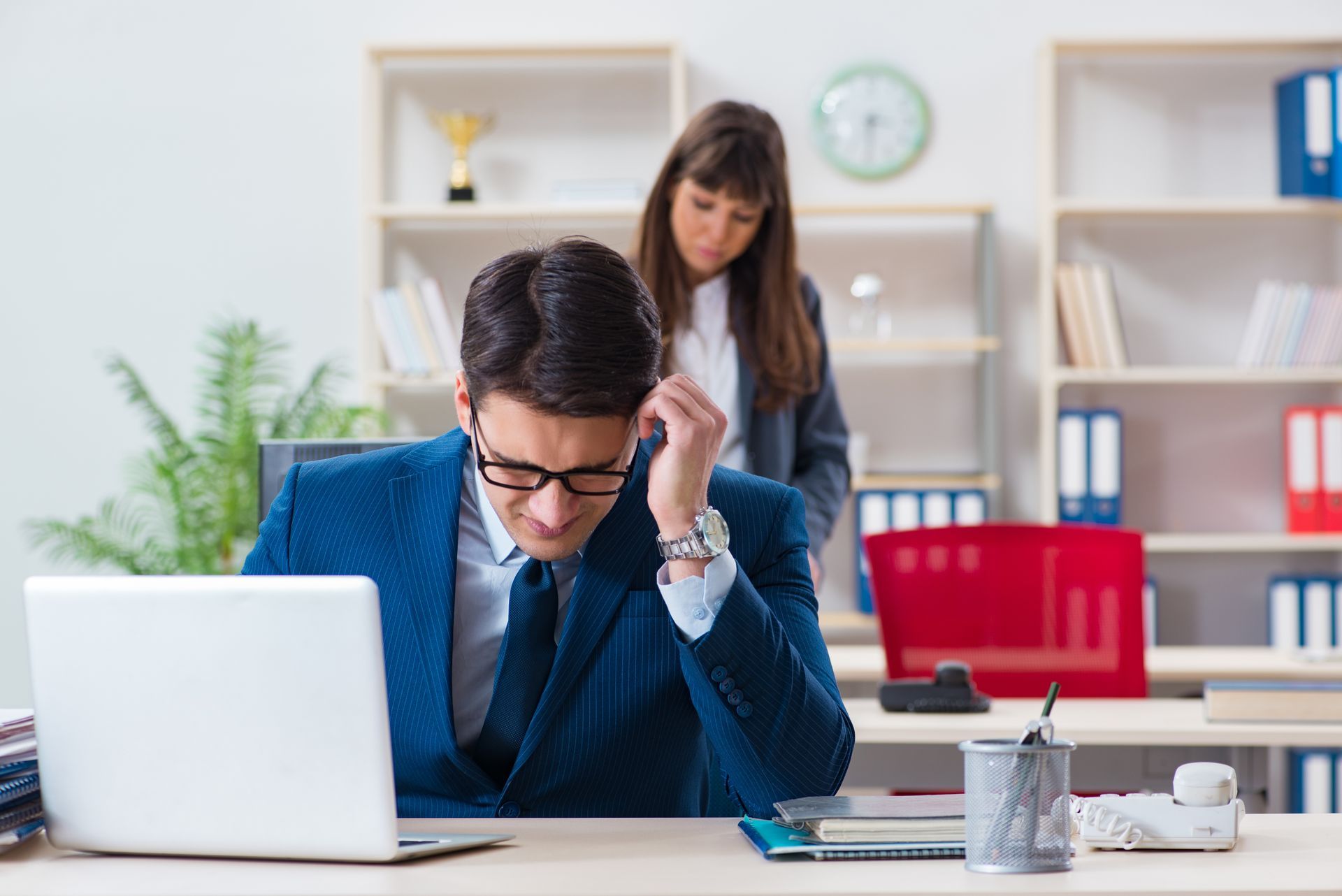 Employee Sits at a Desk Looking Stressed — Australian Employee Lawyers in Sunshine Coast, QLD