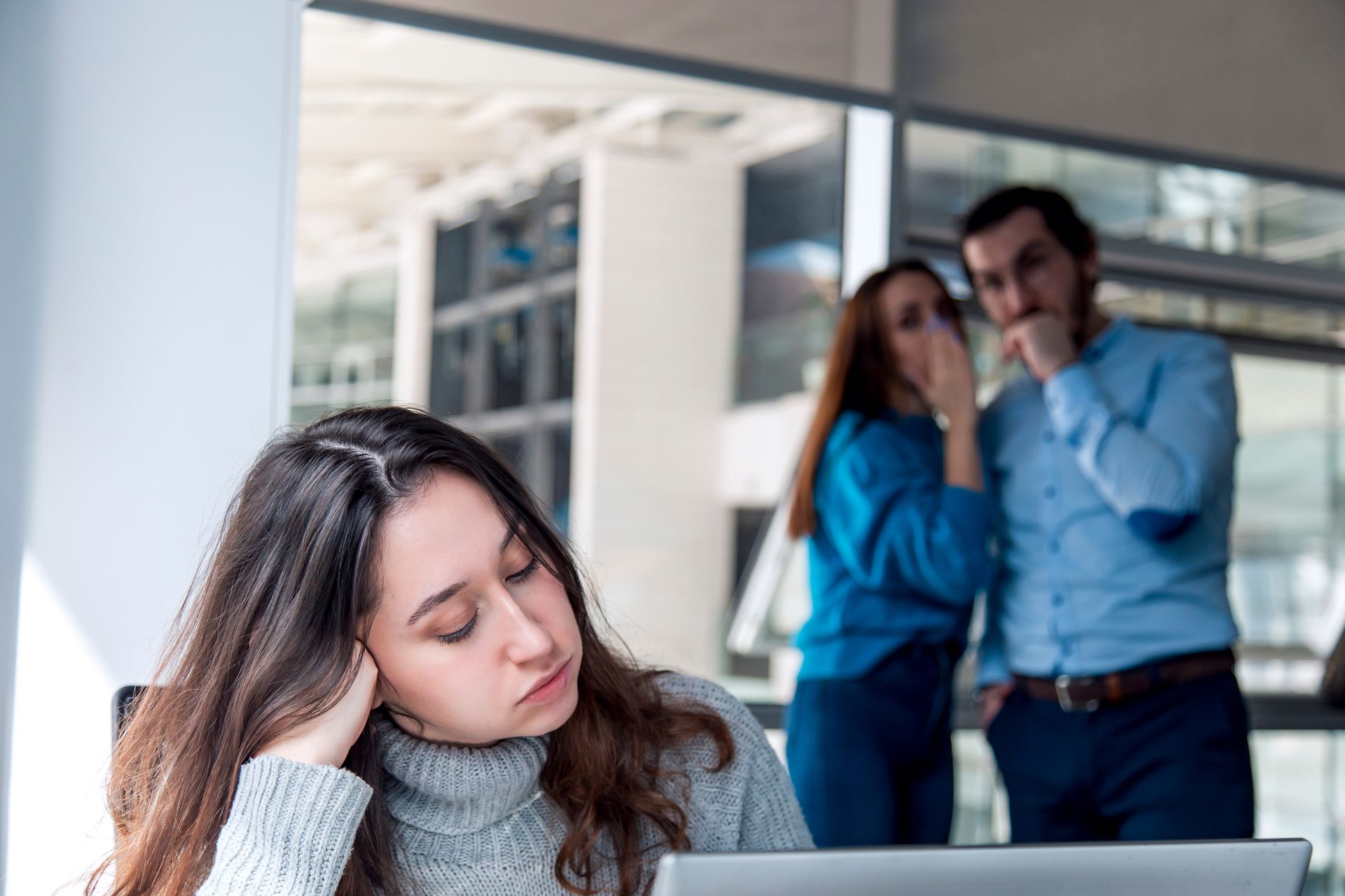 A Woman Sits at a Desk Looking Distressed — Australian Employee Lawyers in Sunshine Coast, QLD