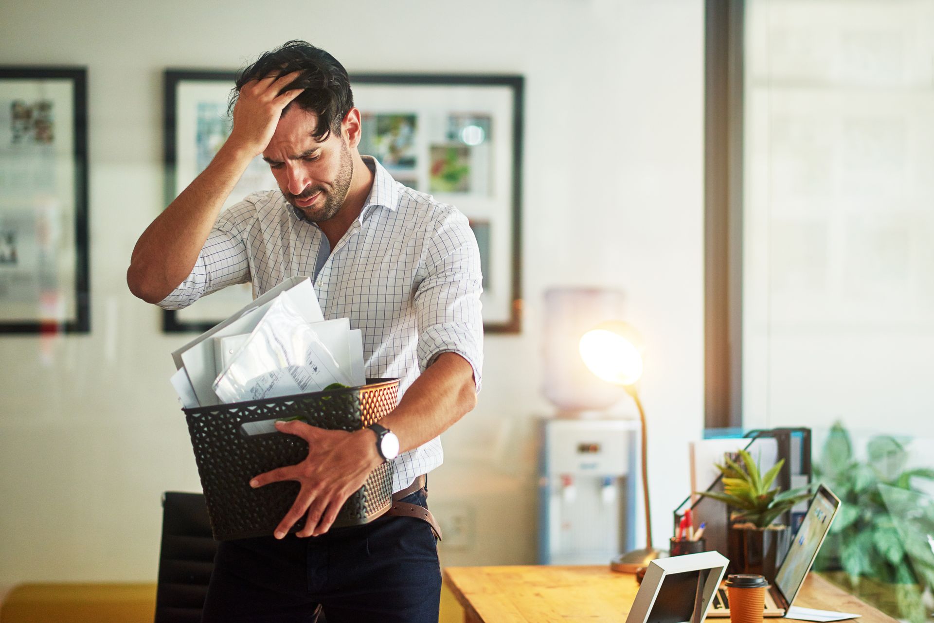 A Distressed Person Holds a Box of Office Belongings — Australian Employee Lawyers in Broadbeach Waters, QLD