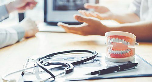 Stethoscope and Denture Model — Oak Forest, IL — Arel C. Ondoy, DMD