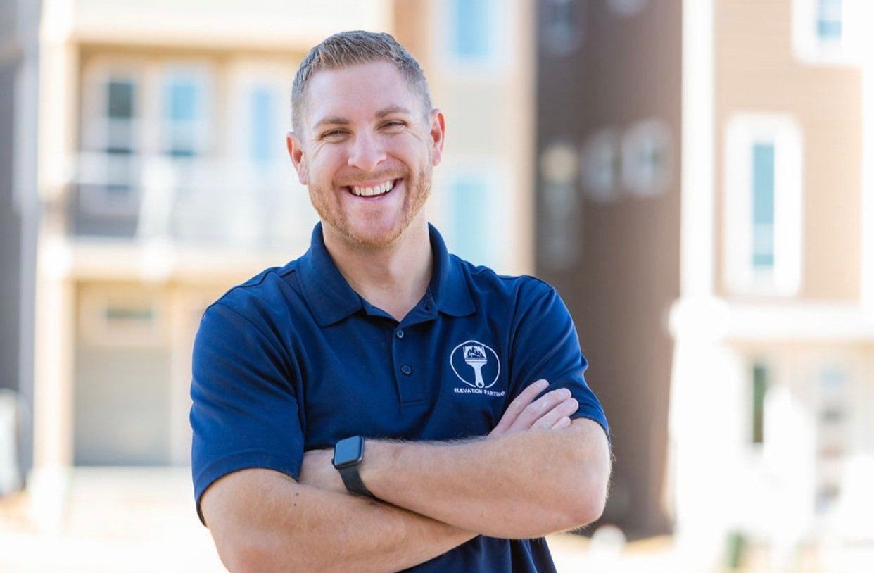 Smiling Business Owner — Castle Rock, CO — Elevation Painting Smiling Business Owner — Castle Rock, CO — Elevation Painting