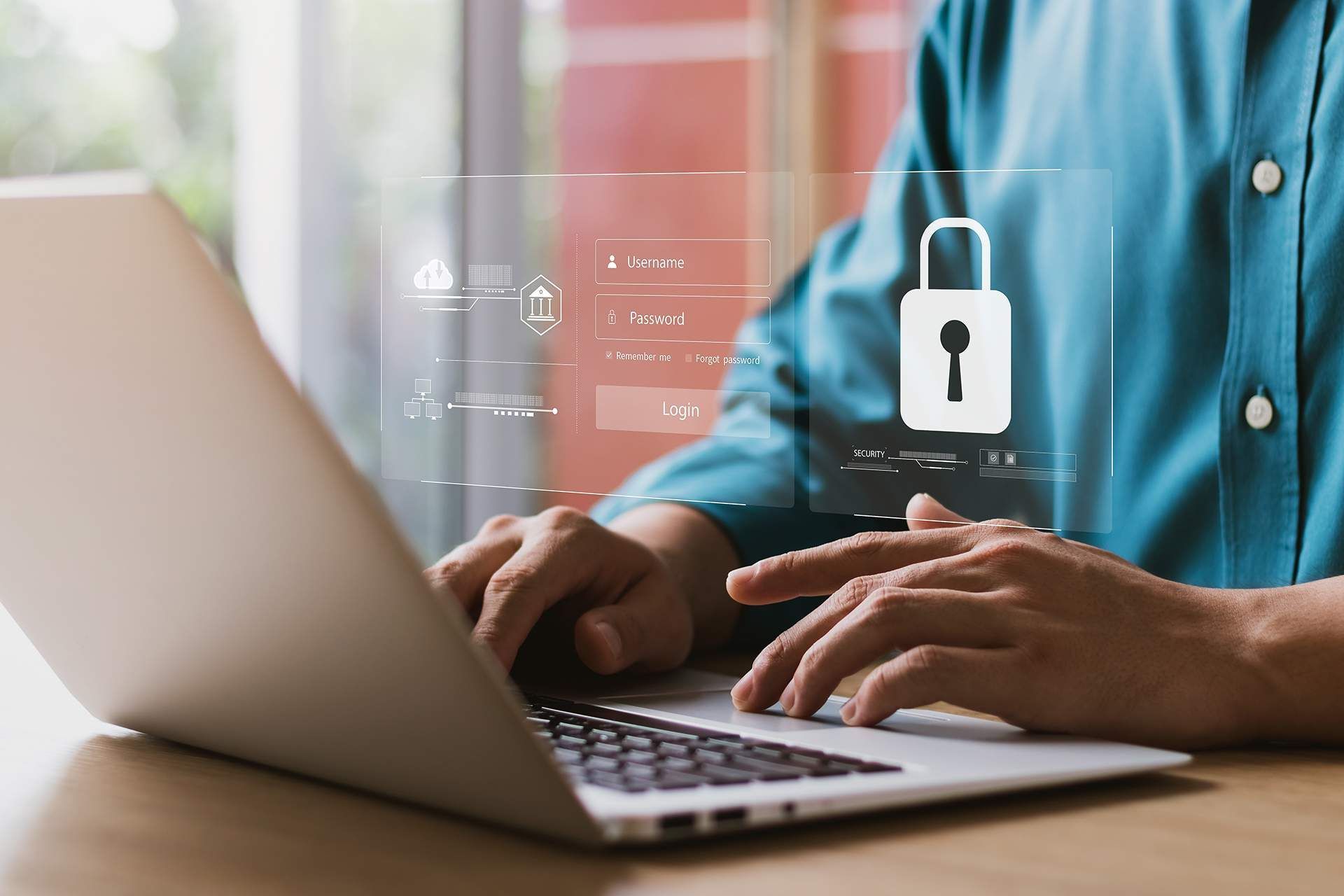 A man is typing on a laptop computer with a padlock on the screen.