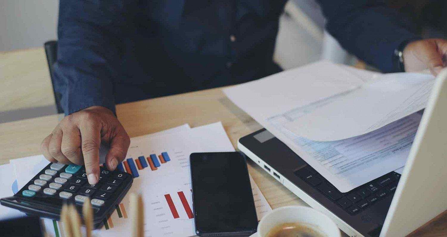 A calculator is sitting on top of a W-2 form